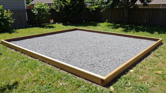 Level compacted gravel shed base with a timber border ready for a Duramax shed.