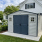 Duramax RidgeLine 10.5x10.5 vinyl storage shed 10124 in a landscaped backyard