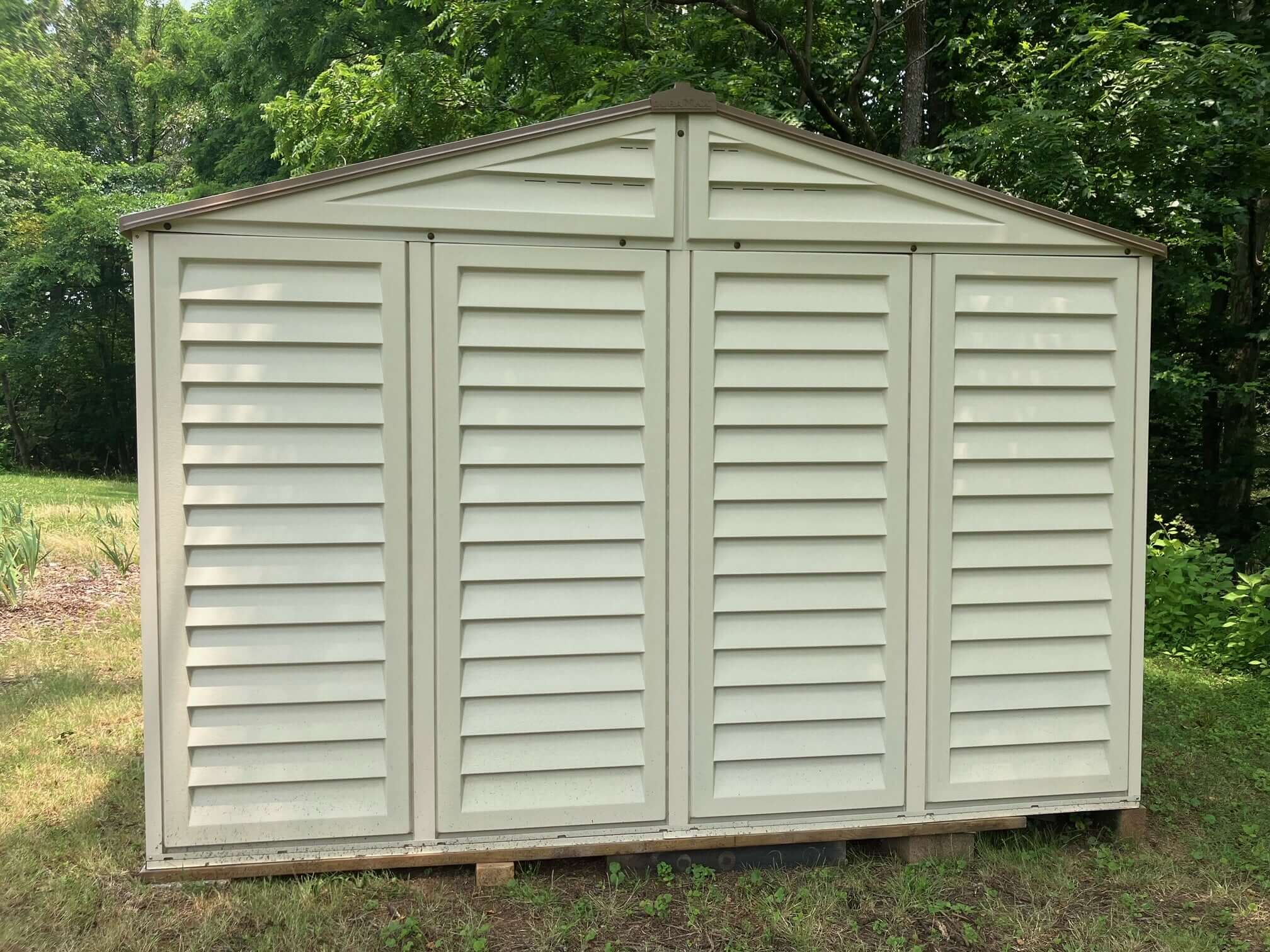 Duramax 10.5ft X13ft Woodbridge Vinyl Plus with Foundation 40234 CA rear view of shed in back yard